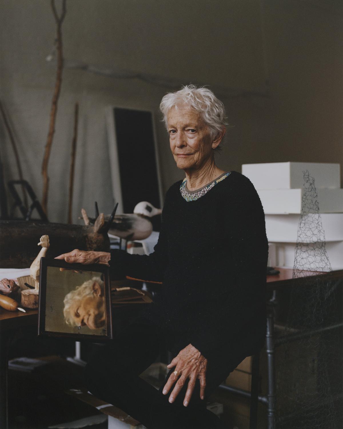 A photograph of a woman in a studio
