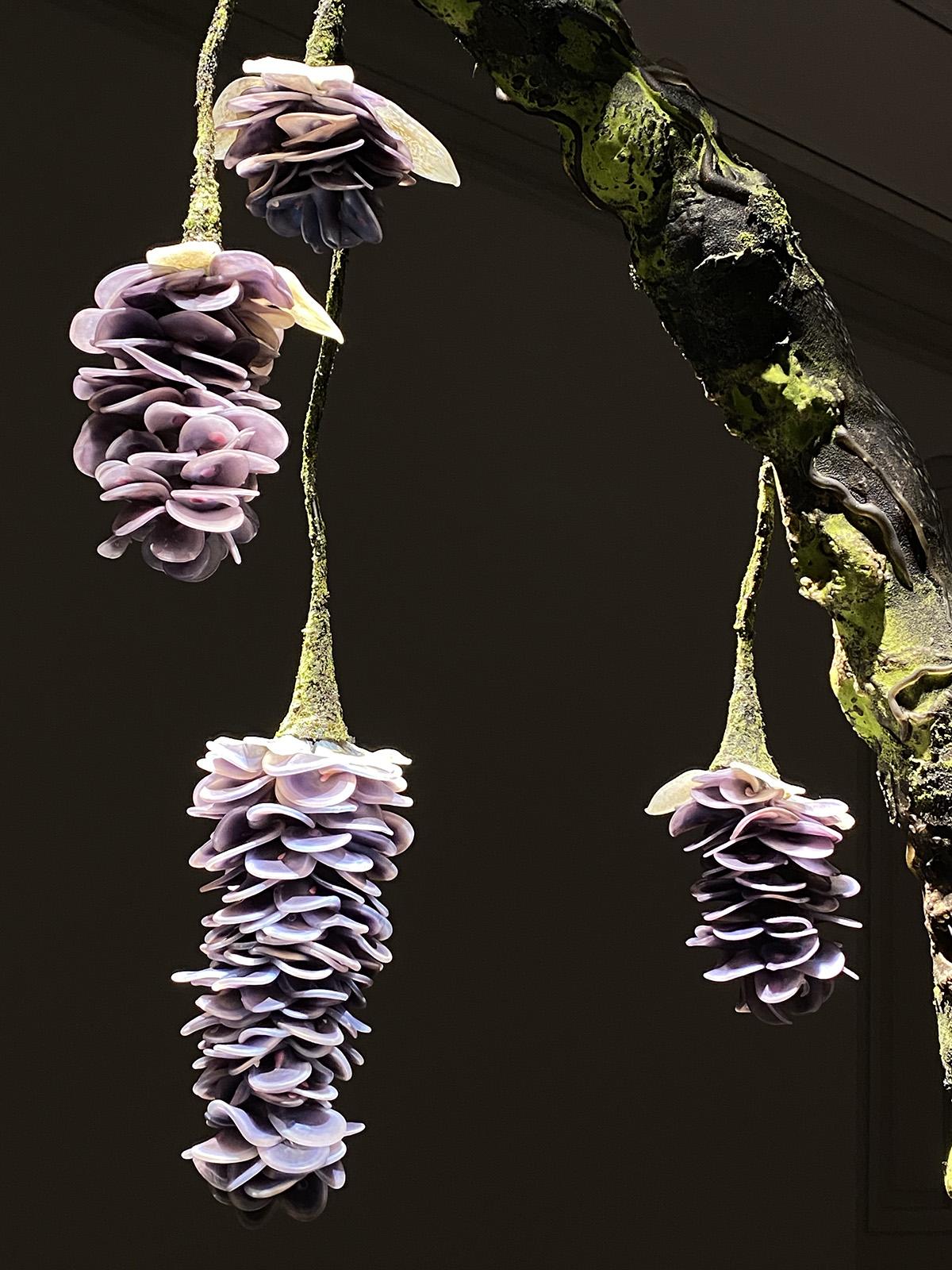 An installation photograph of flowers made of glass