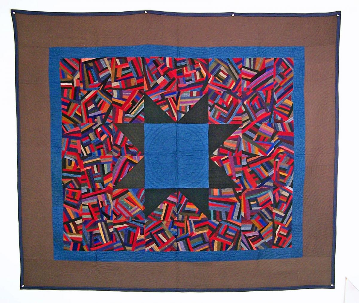 Crazy Star Quilt in brown, red, and blue