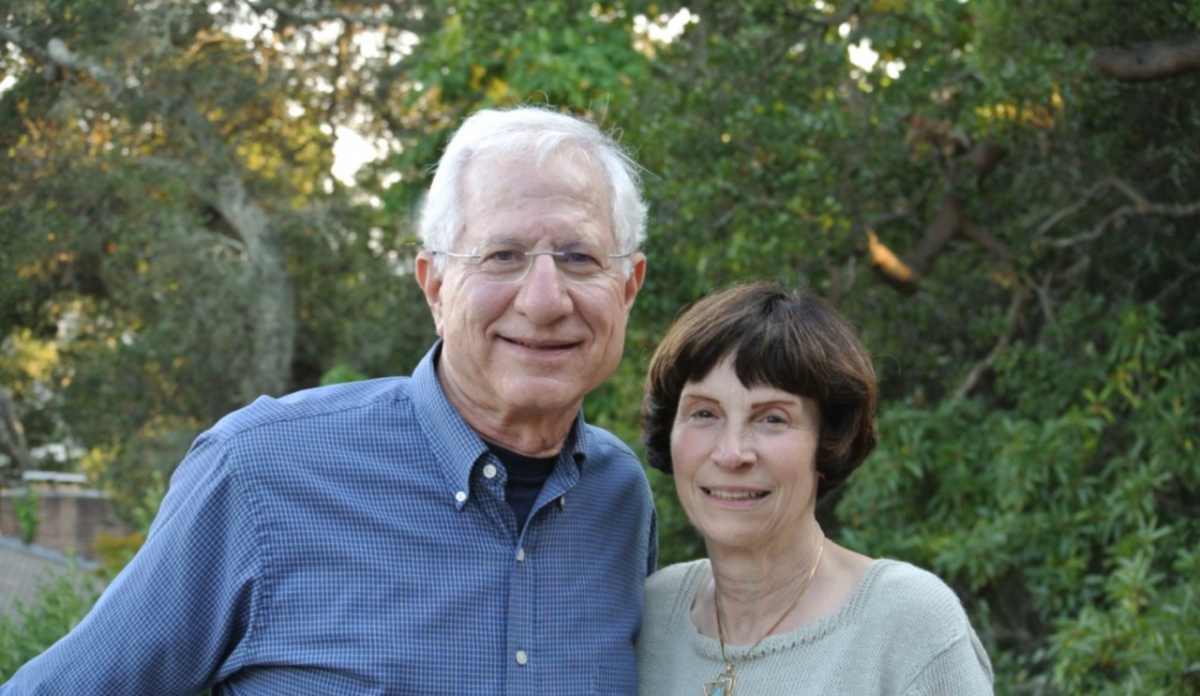 Photograph of a man with white hair and a woman with brown hair.