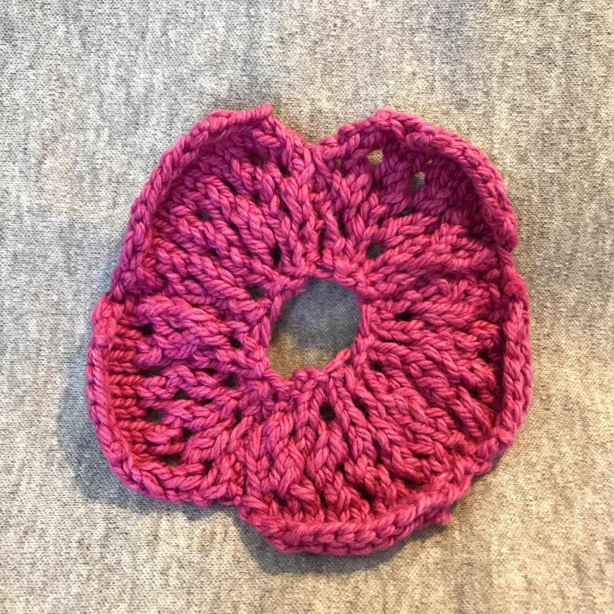 A pink knitted circle