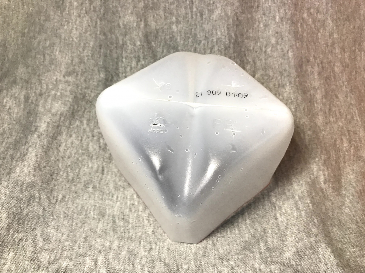 Milk jug cut and upside down