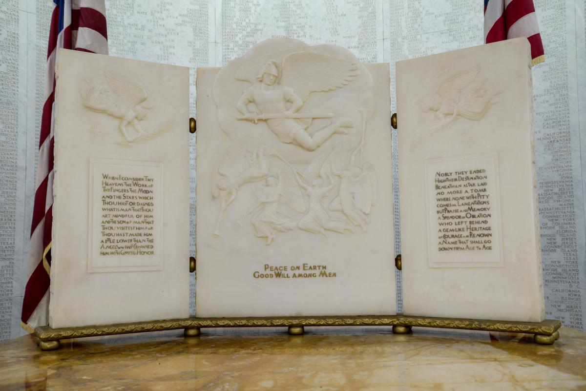 Marble triptych with carved reliefs featuring angles. 