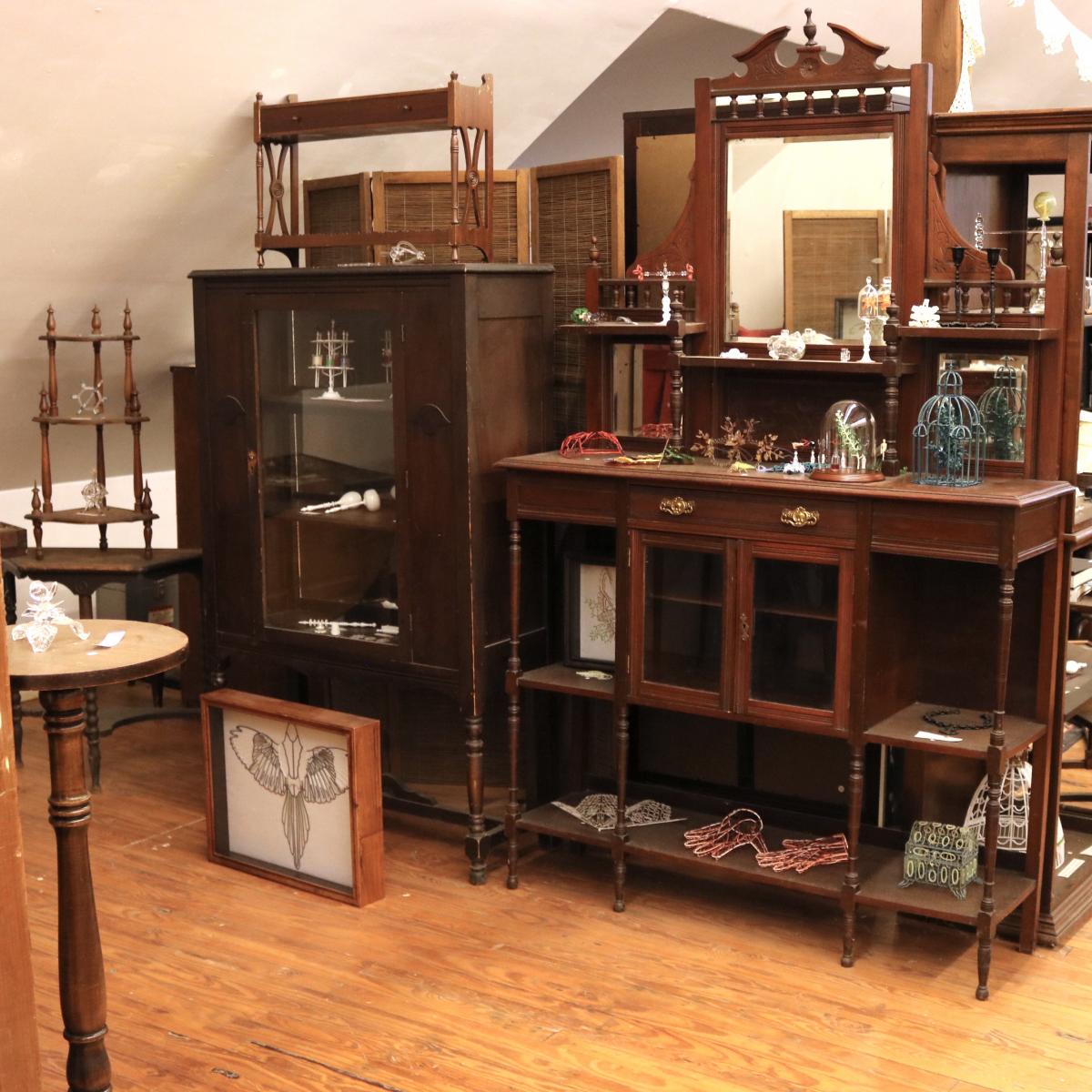 Shelves of furniture filled with objects used by the artist.