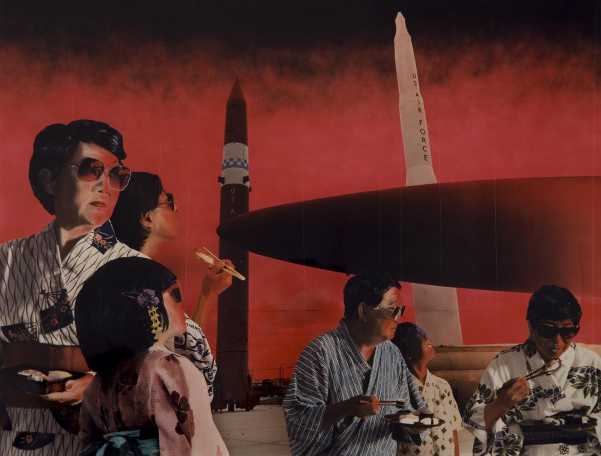 Group of Japanese people wearing kimonos and eating sushi in the foreground with us air force missiles in the background 