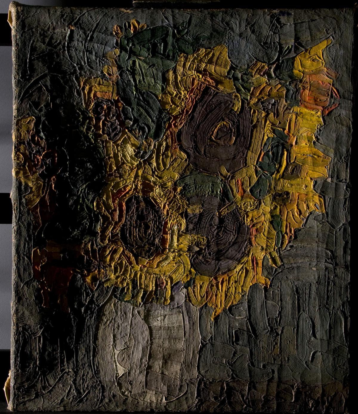 A damaged painting of sunflowers before conservation