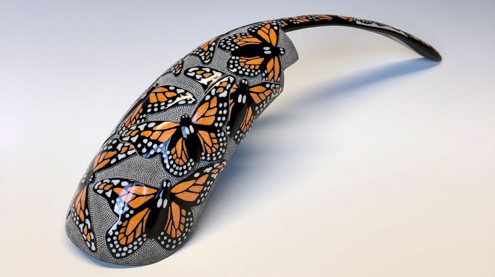 Blog - Key Image, Making the Most Kevin Pourier Fragment of a buffalo horn painted with orange butterflies on it.