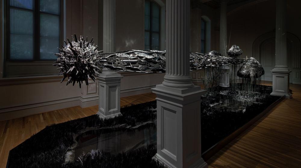 Image of large installation artwork of a comet suspended from the ceiling