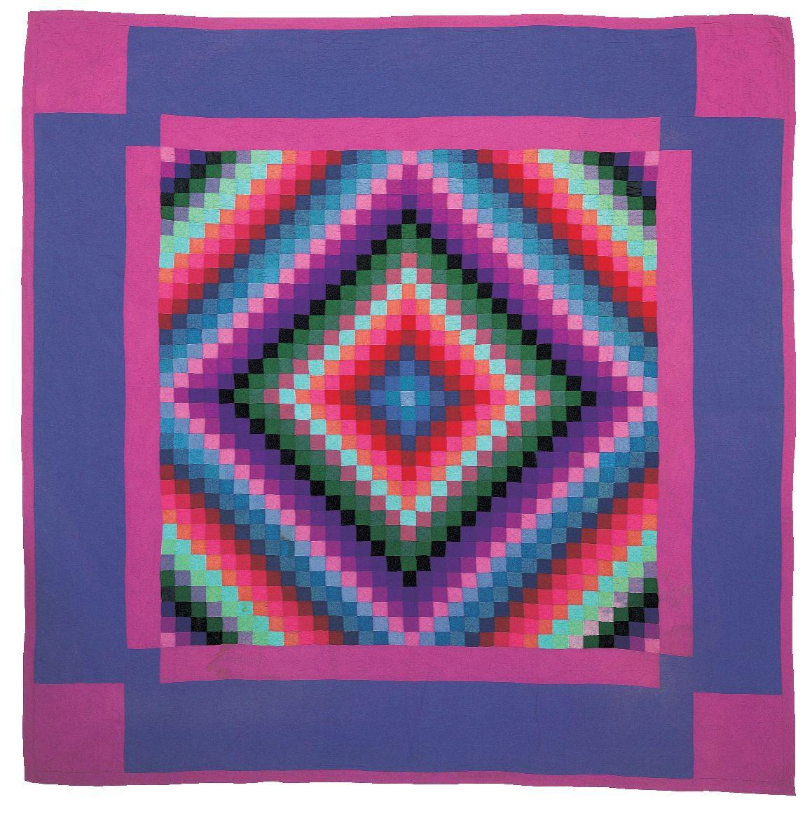 A quilt with a diamond center and a border in purple and pink colors.