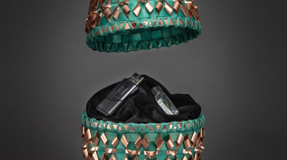 open egg shaped basket with flash drive inside 