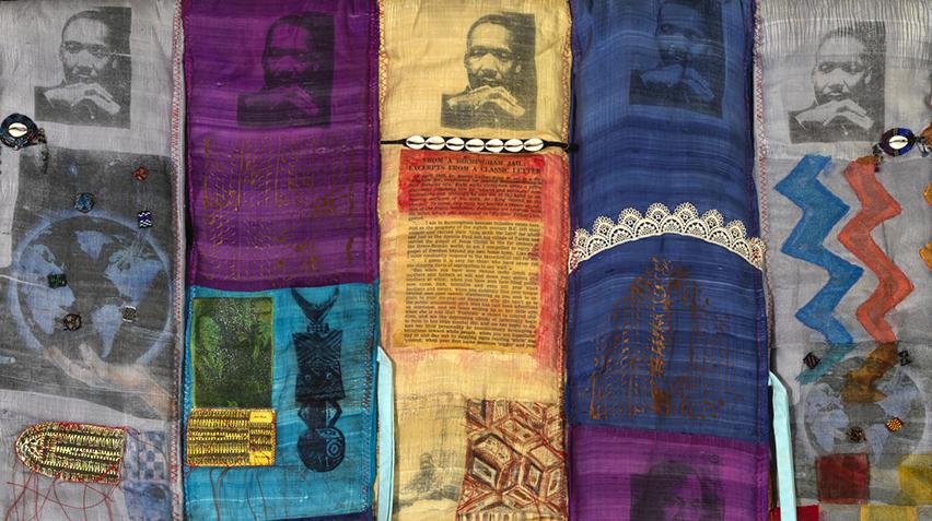 Detail of a quilt featuring images of Martin Luther King Jr.