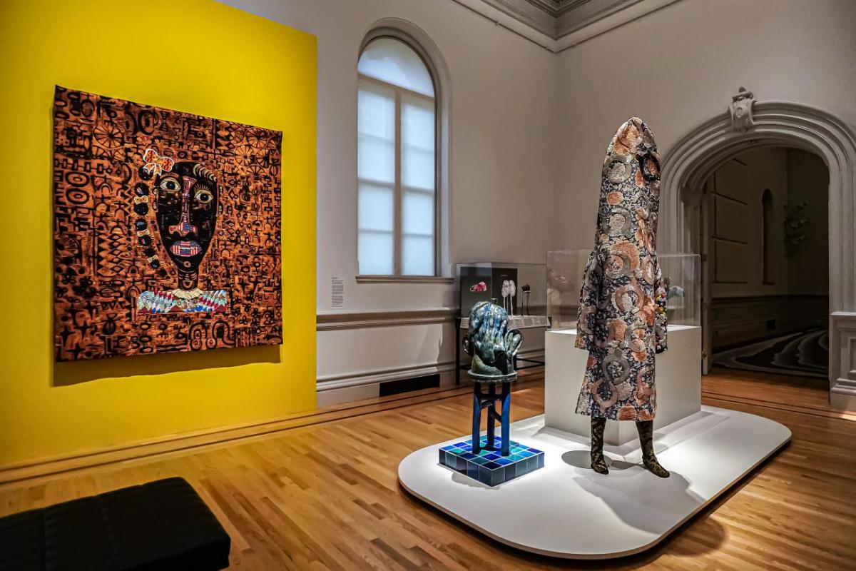 Gallery view of quilt and ceramic sculptures