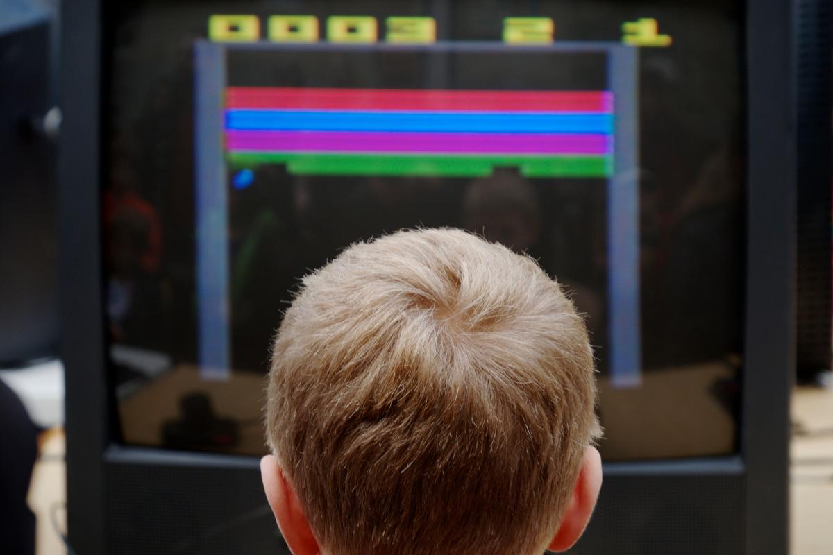 The back of a boy's head playing a game