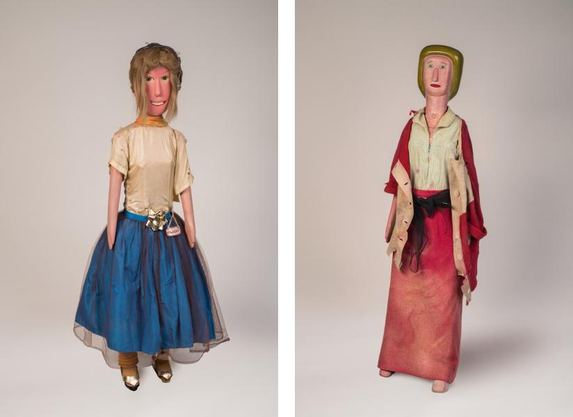 A side-by-side of two hand-made dolls, the one on the left is wearing a blue skirt and the one on the right is wearing a red skirt with a red shawl. 