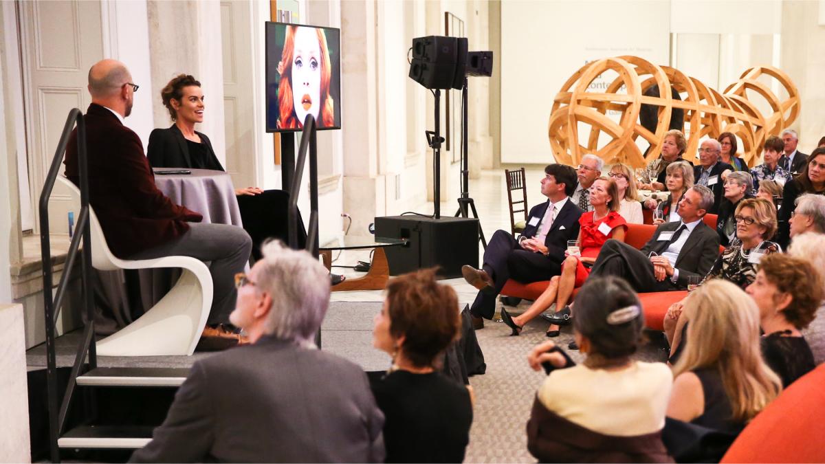 Two lecturers talk about in art in front of an audience in the Lincoln Gallery