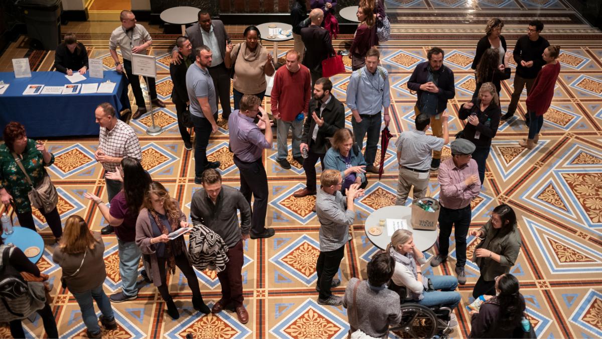 Patrons using sign language at a party at SAAM