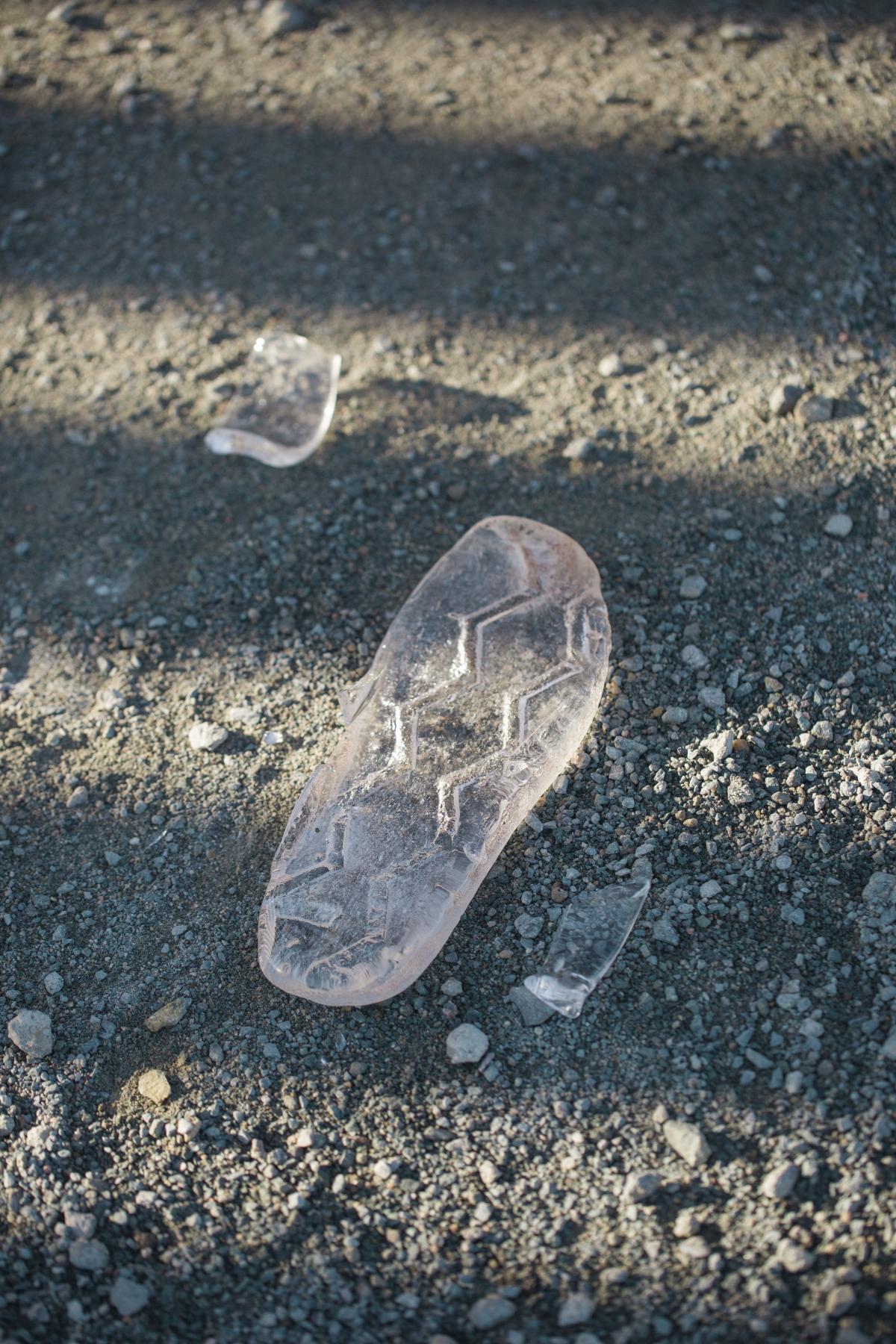 Broken, glass huaraches worn by artist Tanya Aguiñiga while walking along the U.S./ Mexico border wall