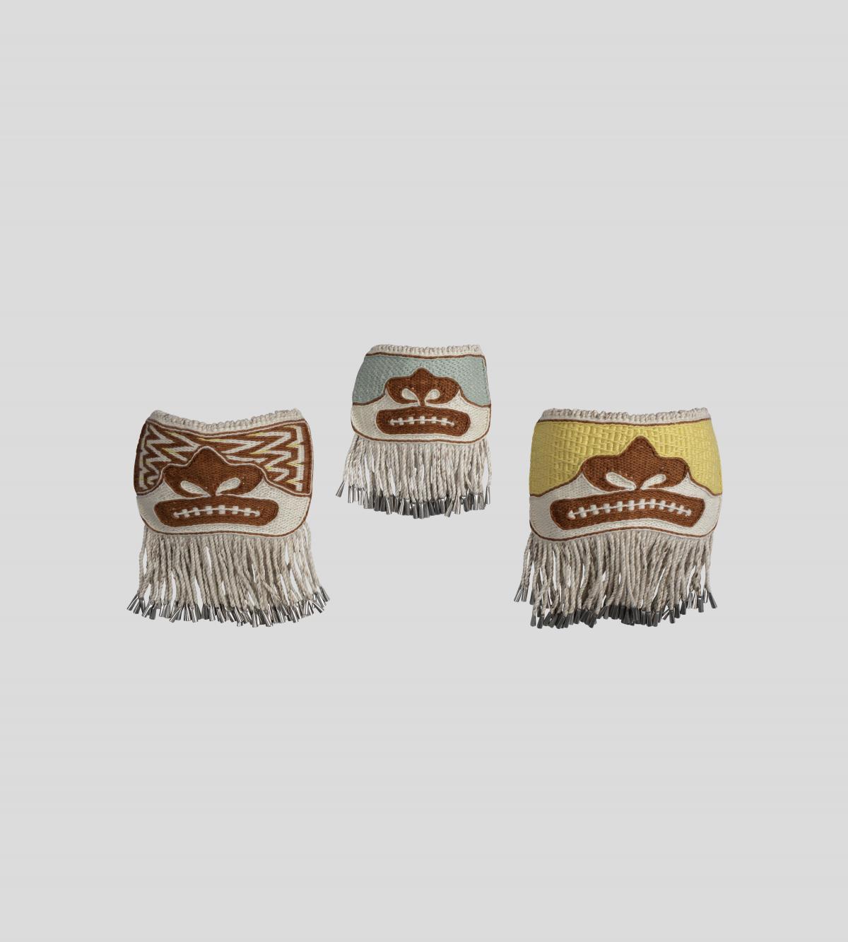 Three woven, ornamental masks