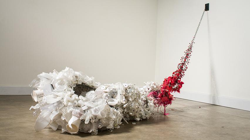 A sculpture made of discarded materials.