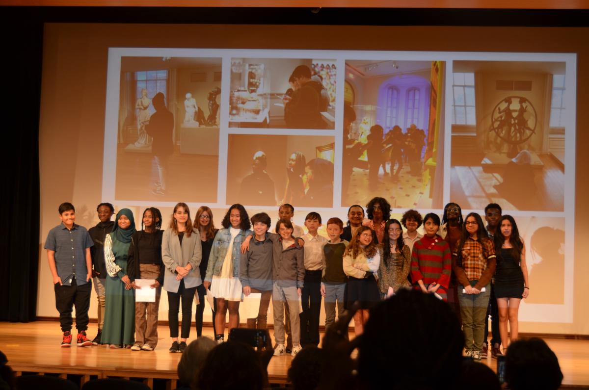 Students gather on stage at SAAM for the program celebrating "Creating American Stories."
