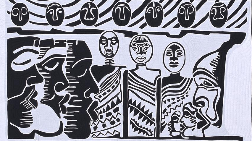 Detail of black and white quilt with rows of stylized human figures.