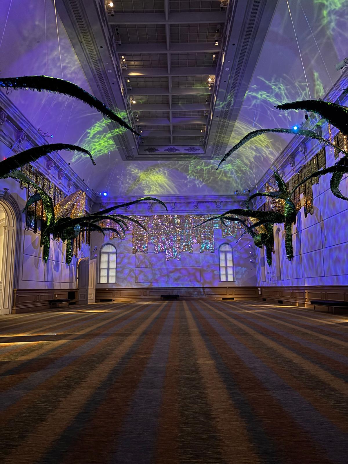 Large-scale installation of corncob piñatas.