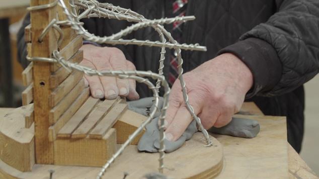 Close up of wood and wire armature.
