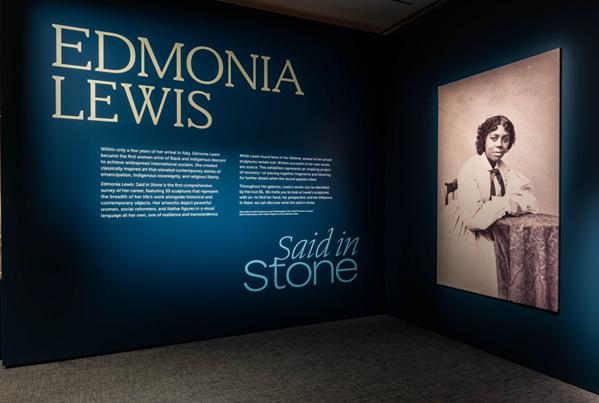 Blue title wall of "Edmonia Lewis: Said in Stone" exhibition.