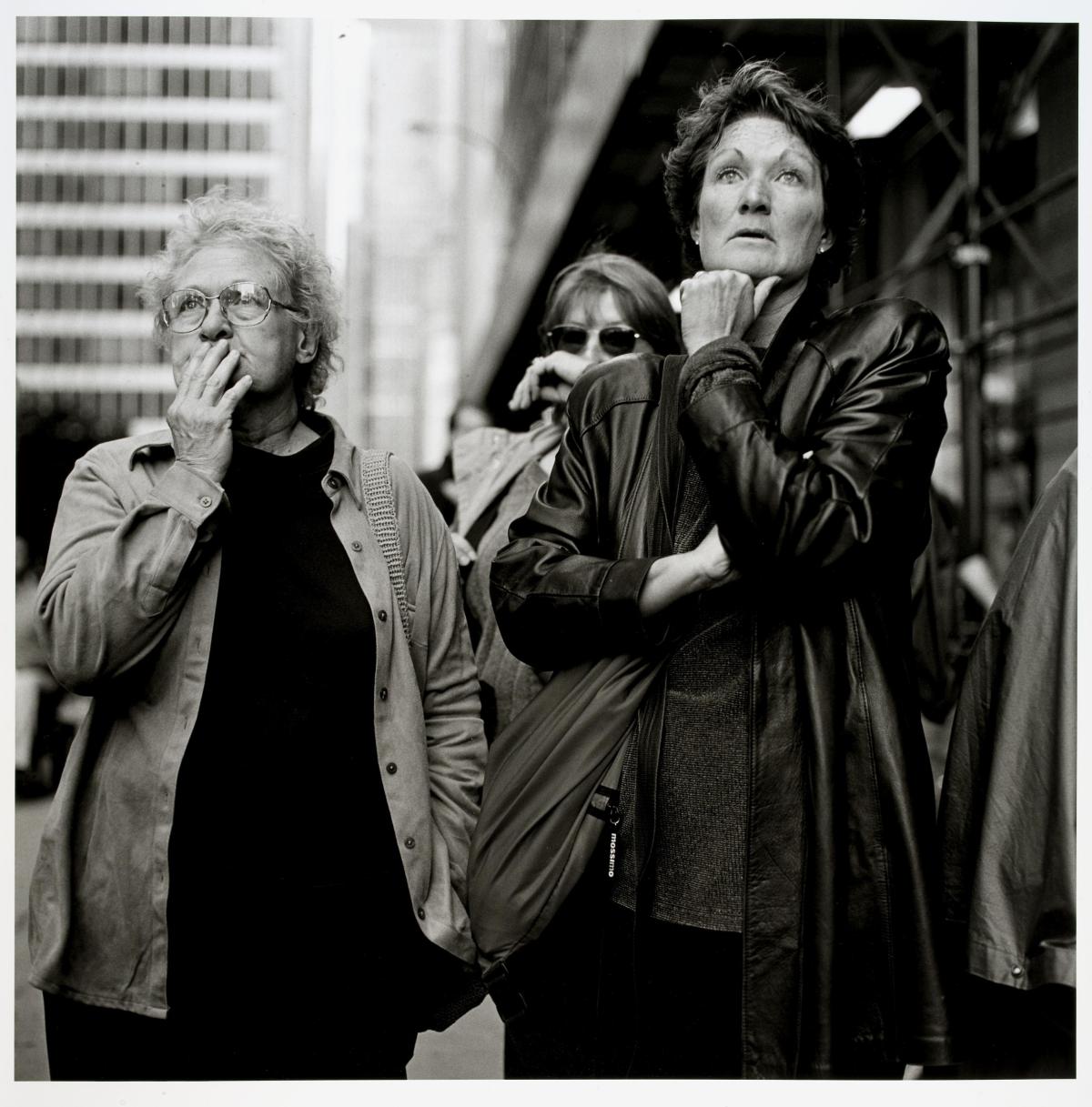 Black and white photograph of onlookers at the World Trade Center.