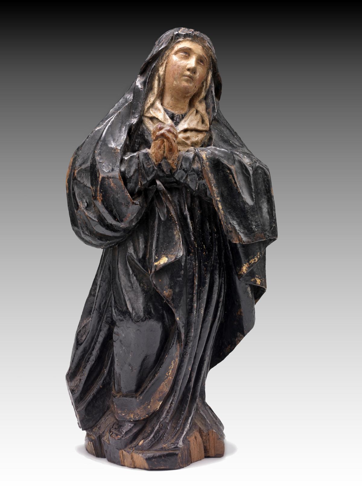 Painted wooden sculpture of Mary.