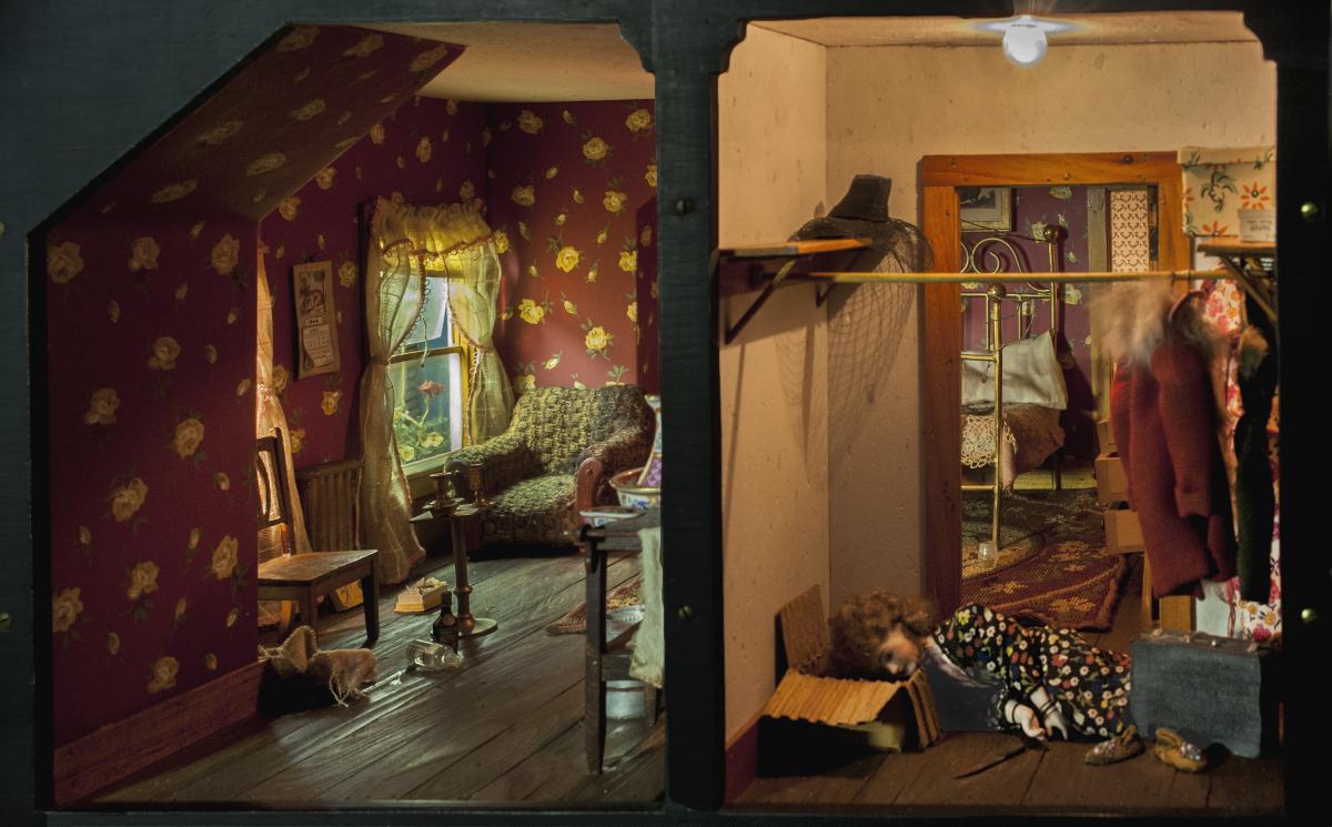 The image shows a view of two room of one of the doll houses