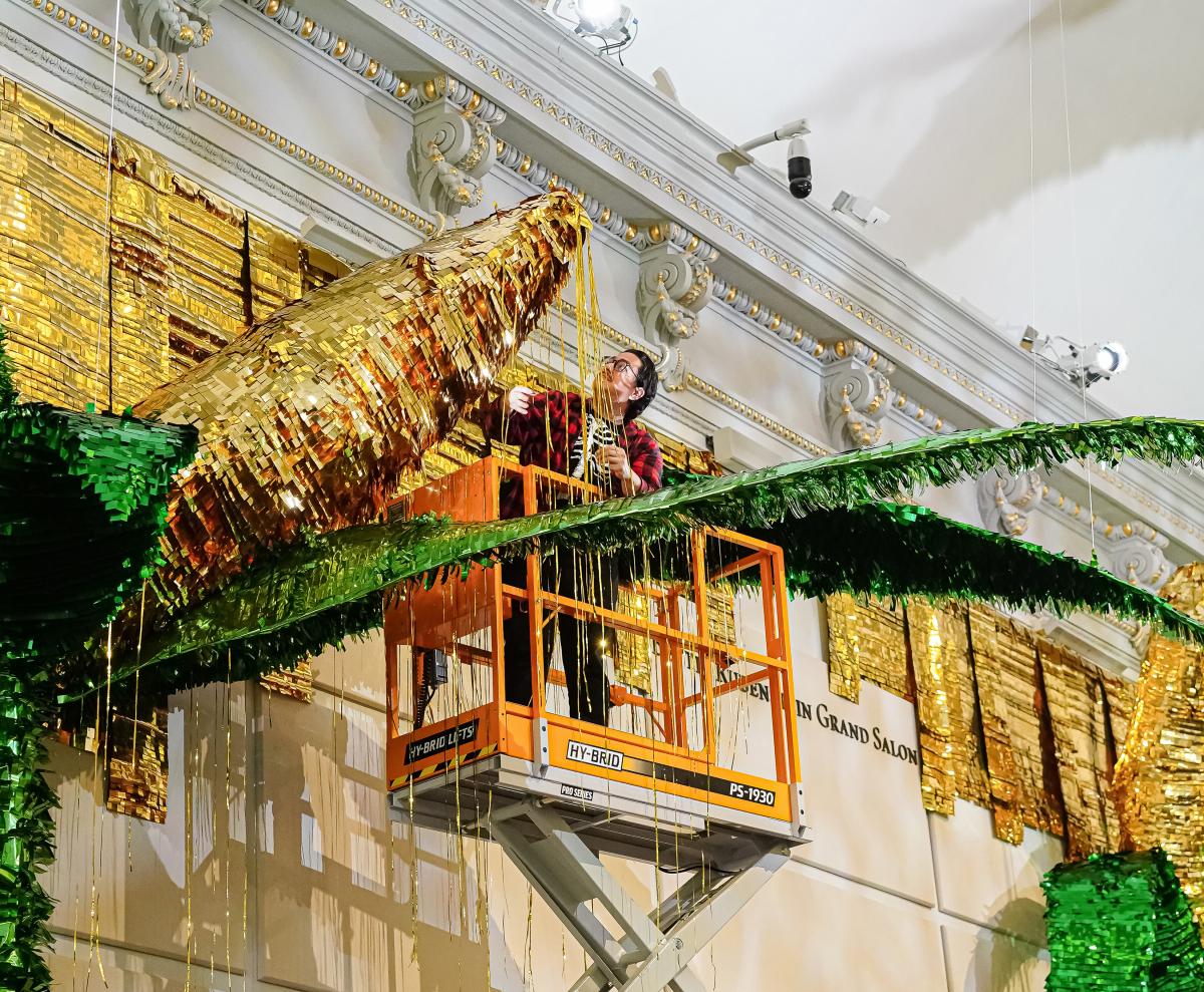 Large-scale installation of corncob piñatas.