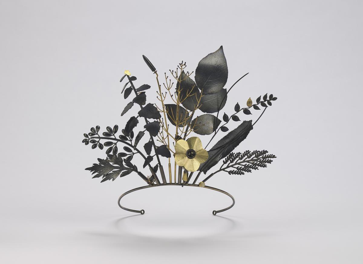 Floral-shaped tiara made of gold, silver, and quartz.