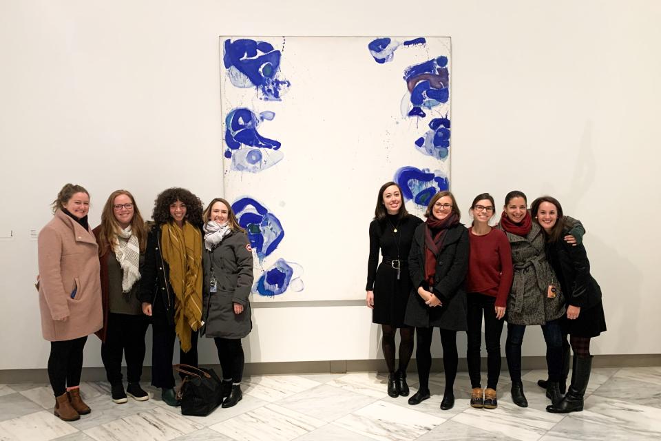 Fellows - Group - 3x2 A group of fellows pose in front of a large abstract blue and white painting