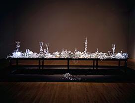 hand sculpted and blown glass arranged on a table. 