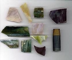 Ten shards of stained glass and one shotgun shell