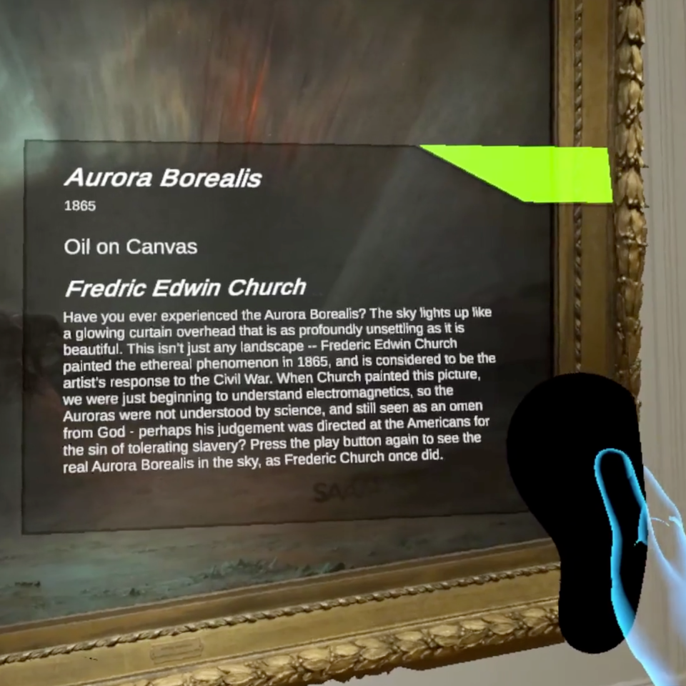 An artwork with the northern lights and a remote controller with text over the artwork.