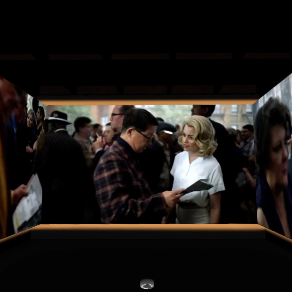 An image of a media room with three screens showing the same film.