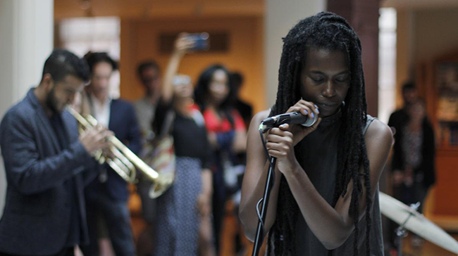 Interdisciplinary artist Camae Ayewa performs with Irreversible Entanglements.