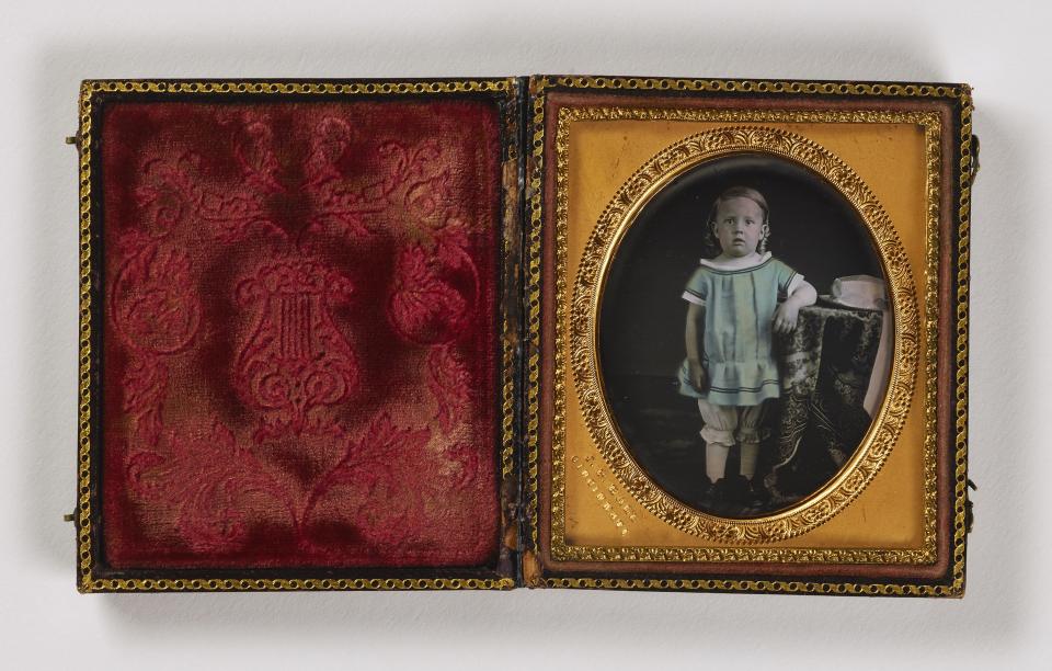 Image of a small child in a frame box