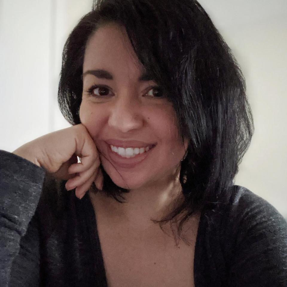 Headshot of woman with black hair