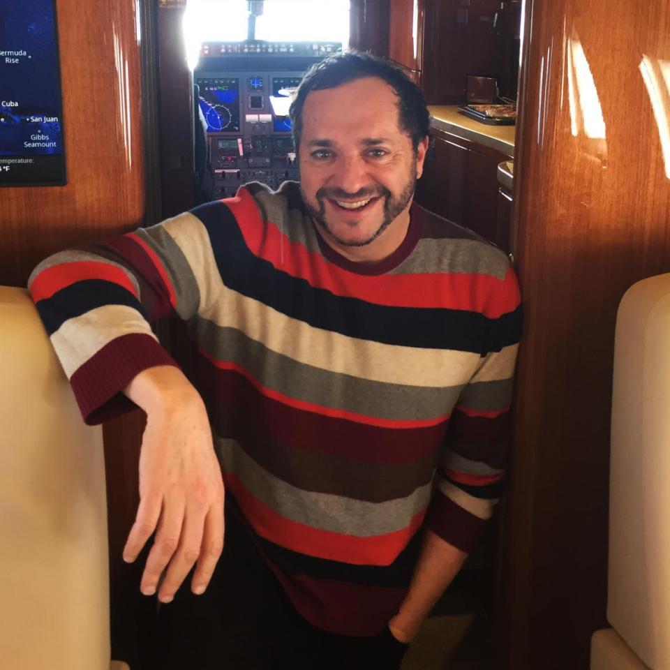 A photograph of Howard Kaplan on a plane.