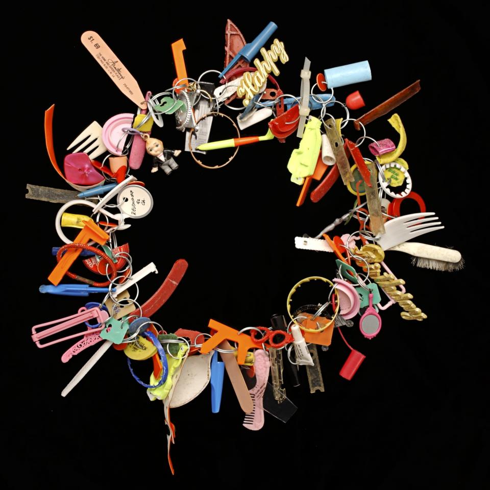 SAAM-2003.27.1_1.jpg Wreath-shaped assemblage made of objects found on the beach.