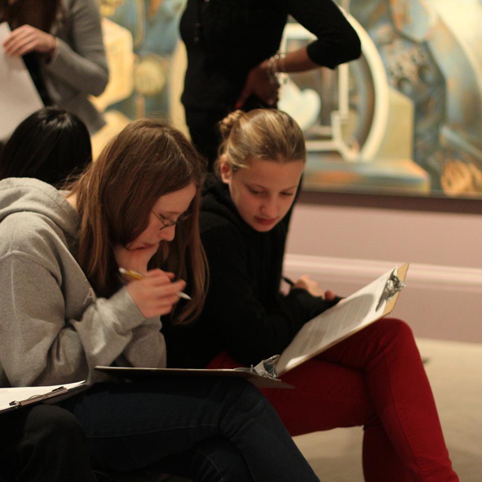 Education - Renwick Resources, Perspective Taking Two teens sitting down and discussing something on a clip board