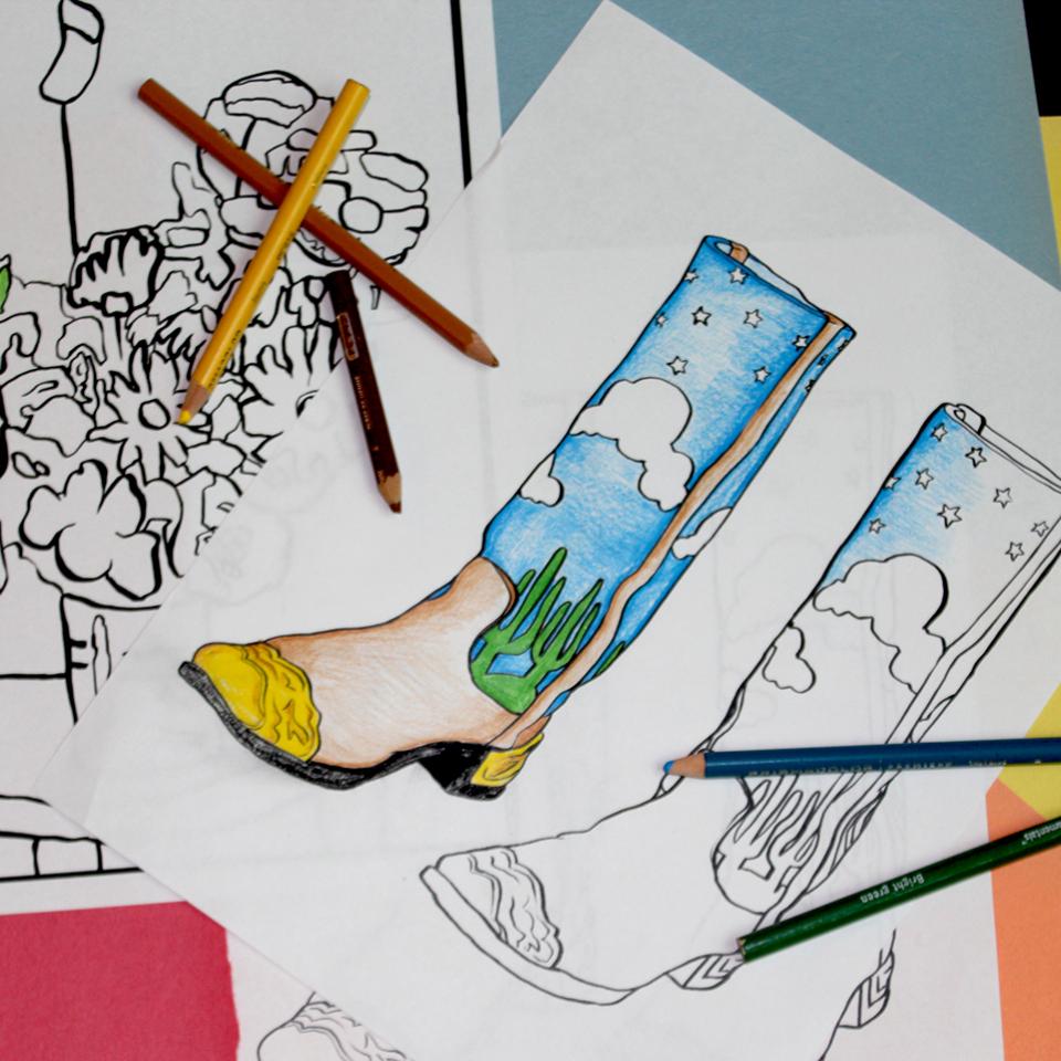 A photograph of coloring pages with colored pencils 