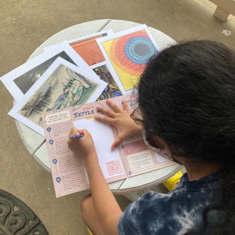 Education - Learn From Home, SEL Toolkit, Option 2 A young student sitting at a desk works their way through printed activities from the Smithsonian American Art Museum.