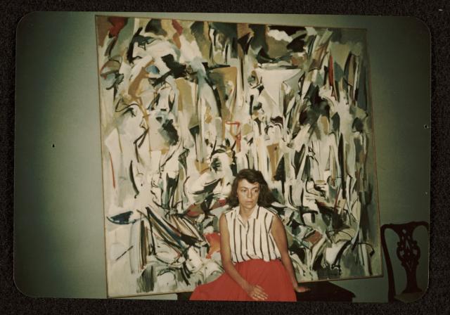 Joan Mitchell Bio A photograph of artist Joan Mitchell with her painting Untitled (1951)