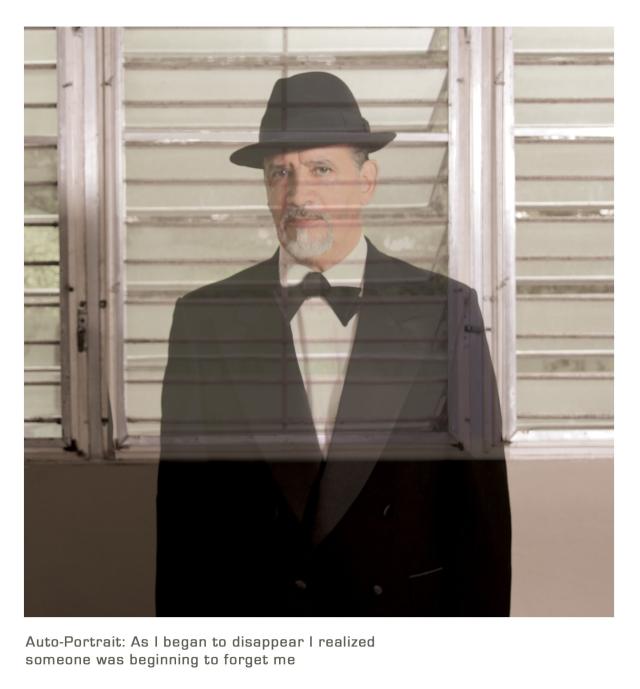Adal Maldonado Portait ADAL wears a tuxedo and fedora in front of windows. Text below him reads "Auto-Portrait: As I began to disappear I realized someone was beginning to forget me"