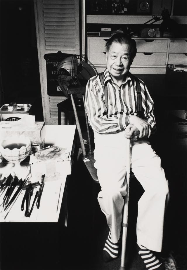 saam-2024.52.41.8_1.jpg Photo of person seated in chair holding a cane