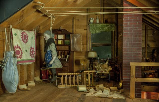 A photograph of a nutshell study of unexplained death showing a woman's death by hanging.